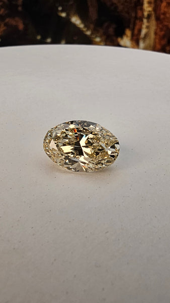 Fancy light brownish greenish Yellow Natural Diamond VS2 7.02ct Oval Shaped GIA